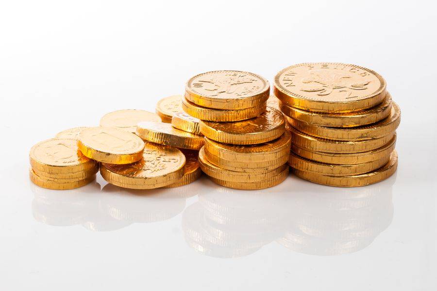 Tumpukan koin emas melambangkan bonus promosi